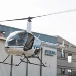 helicopter taking off at Quantum Helicopters, top helicopter pilot school
