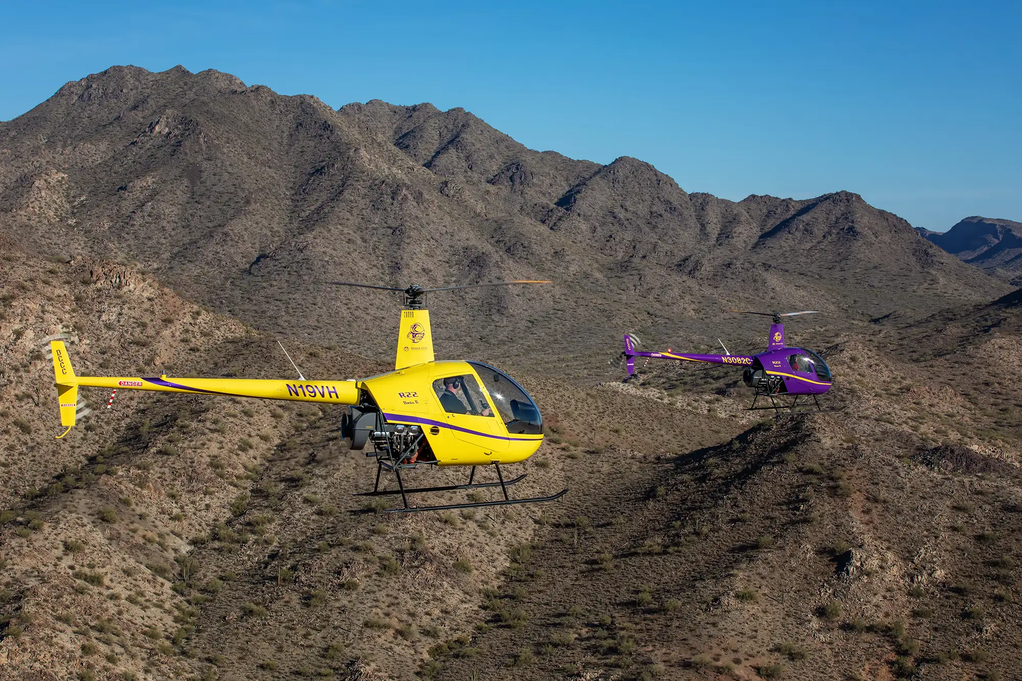 Aerial photography of helicopters flying over desert
