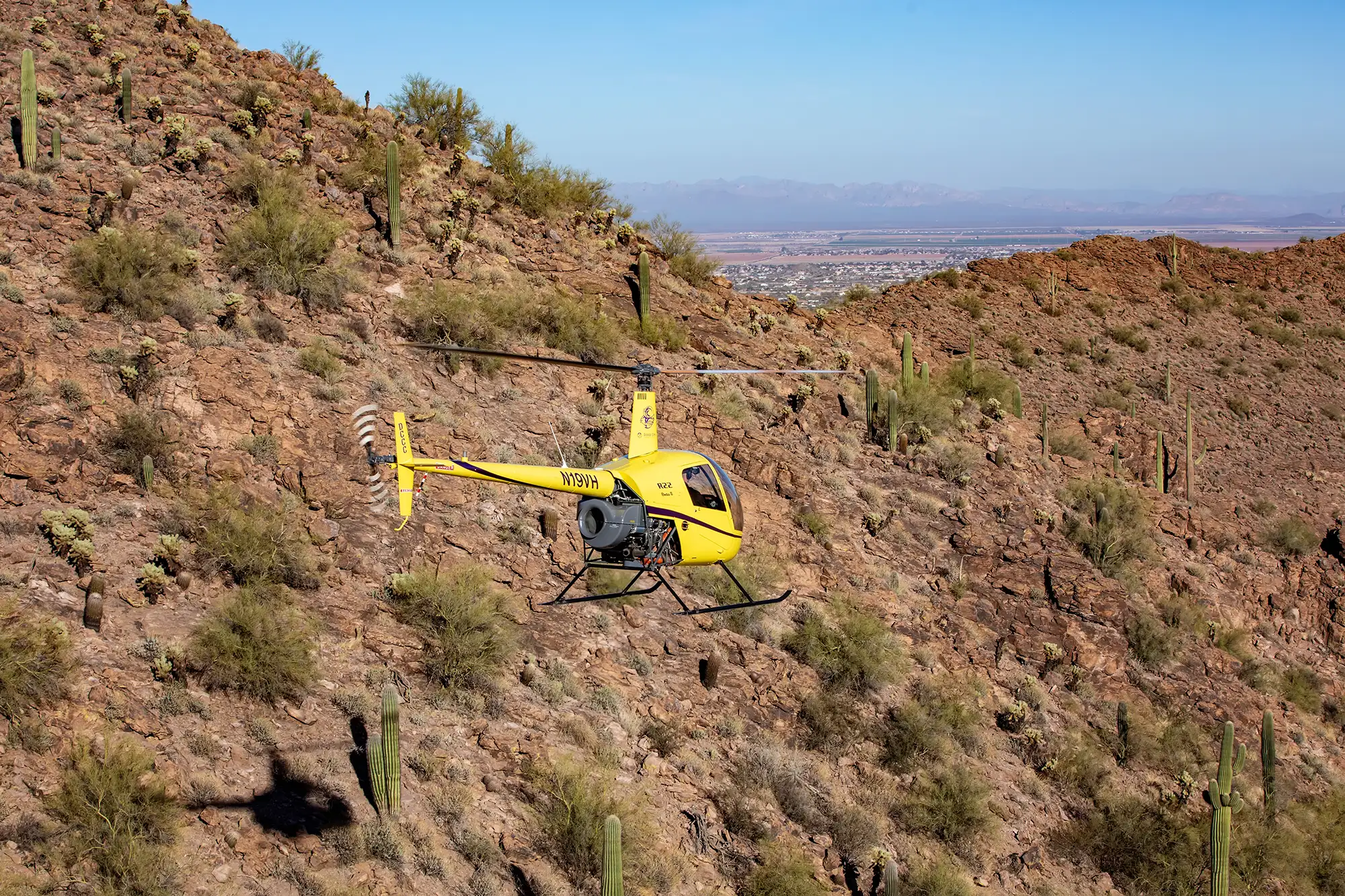 helicopter flying over desert