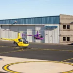 Quantum Helicopters hangar with choppers taking off