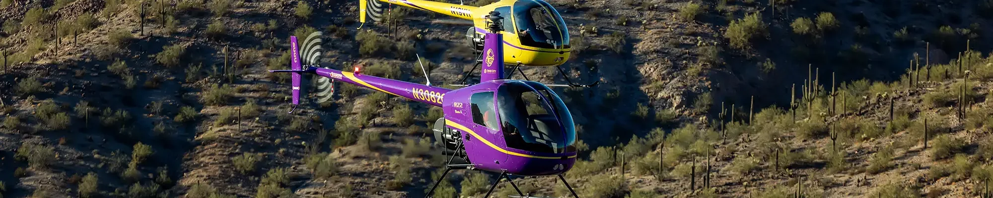 helicopters flying over desert