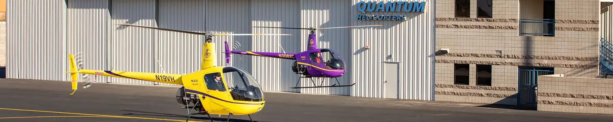 Quantum Helicopters hangar with choppers taking off